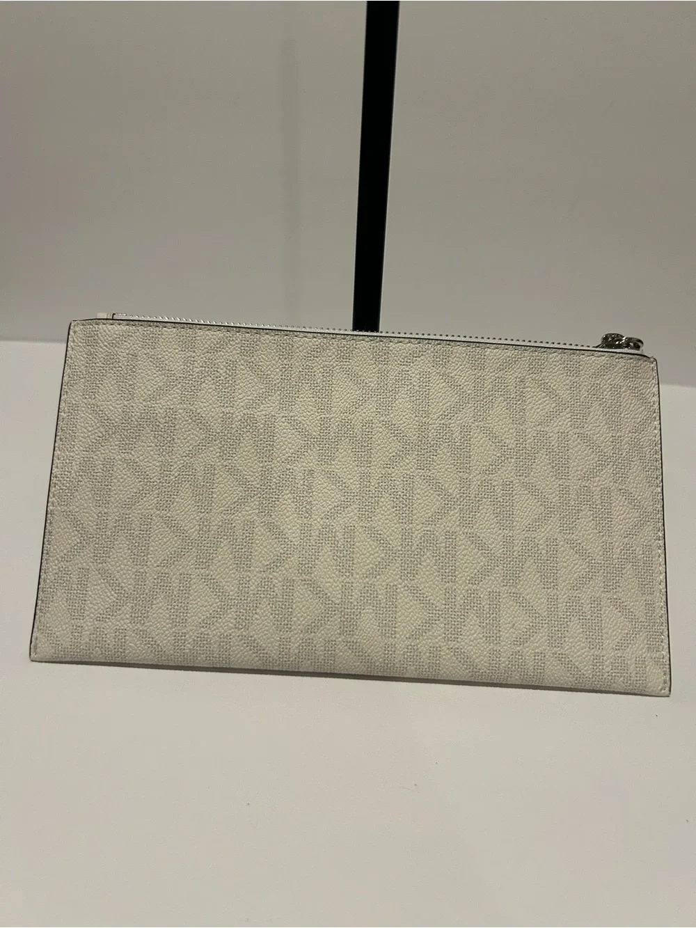 Michael Kors Cream Signature Wristlet with Tassel Charm